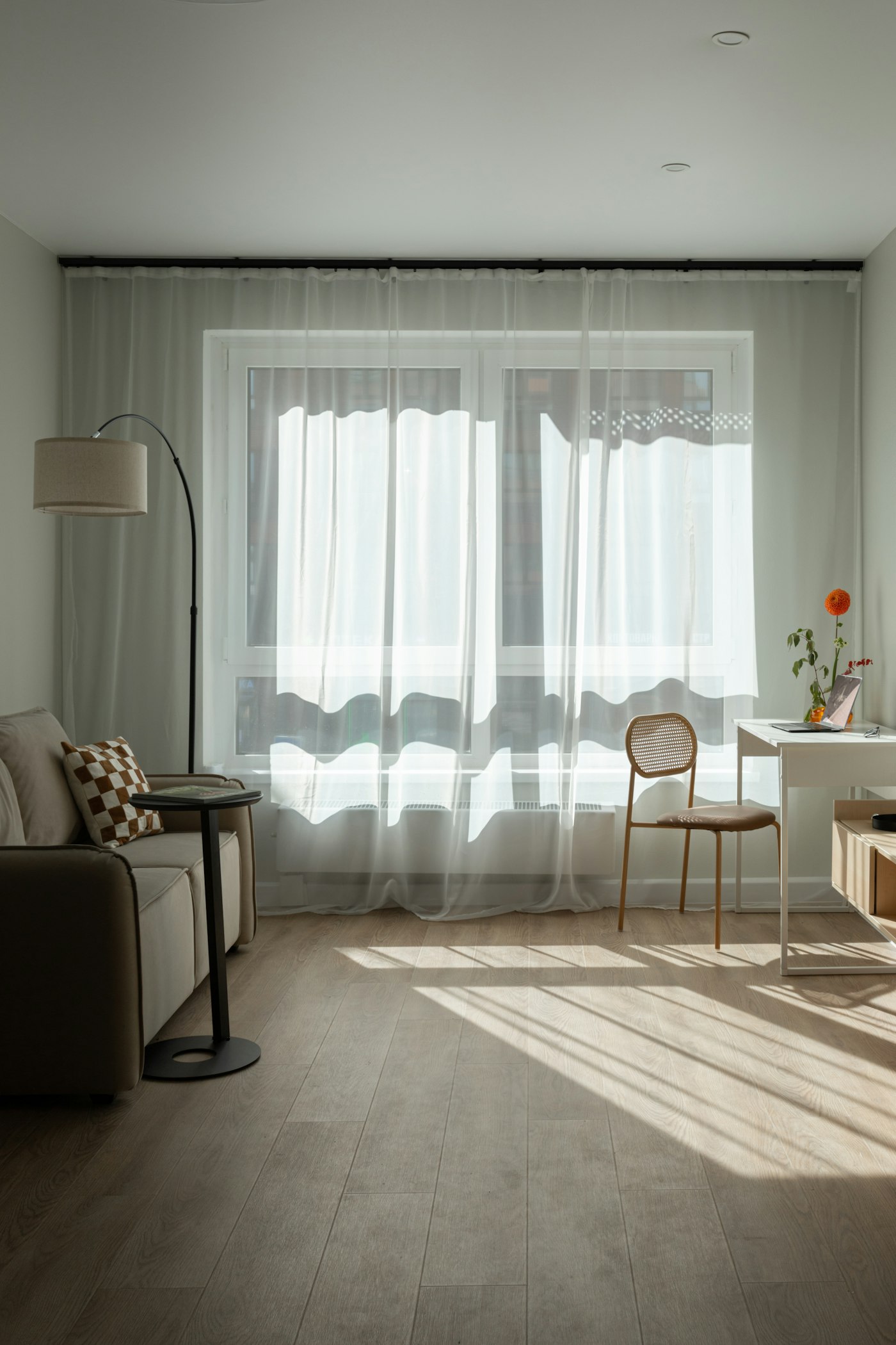 Room with sheer curtains and afternoon light